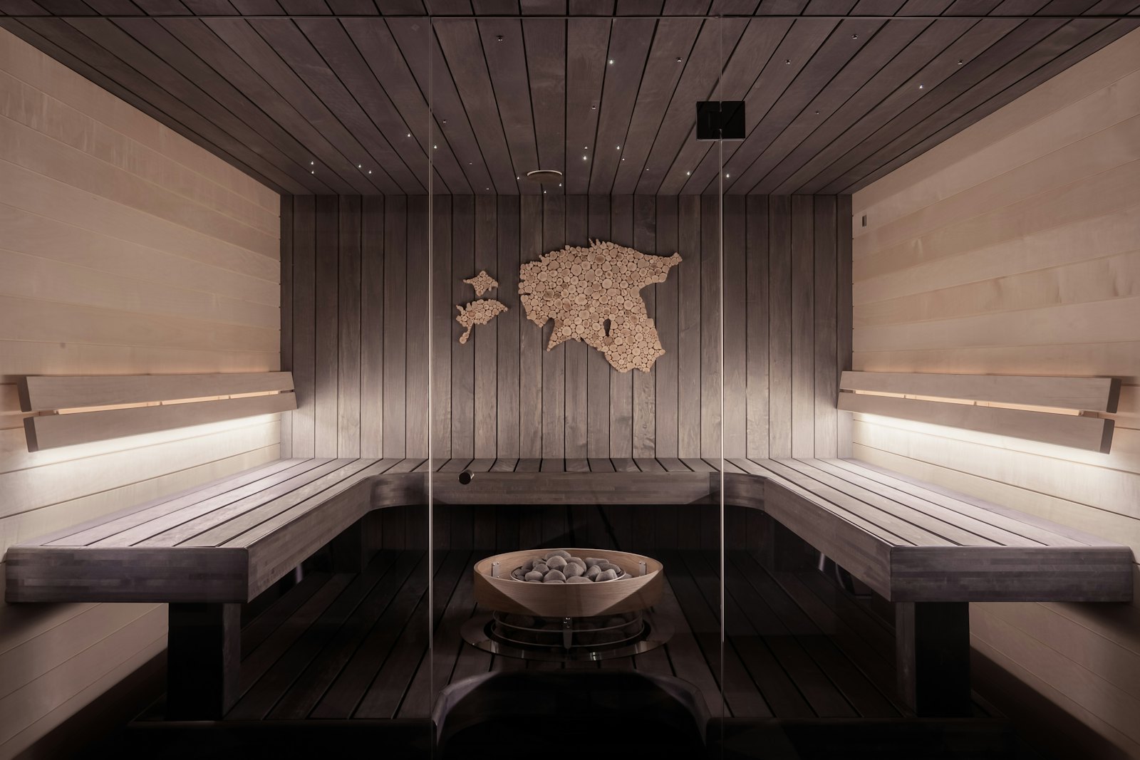 Interior of a traditional cedar sauna with bench seating