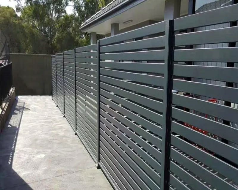 Black horizontal-slat aluminum privacy fence