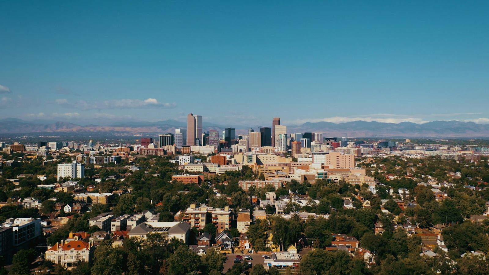 Denver downtown skyline with the Rocky Mountain foothills behind