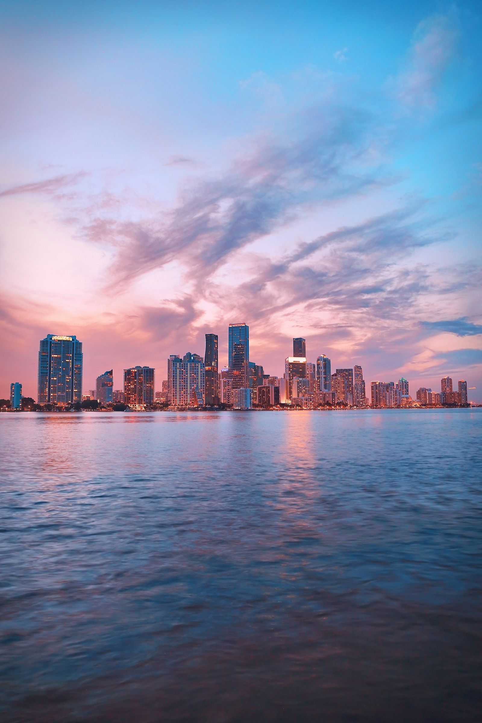 Houston skyline over the water at dusk