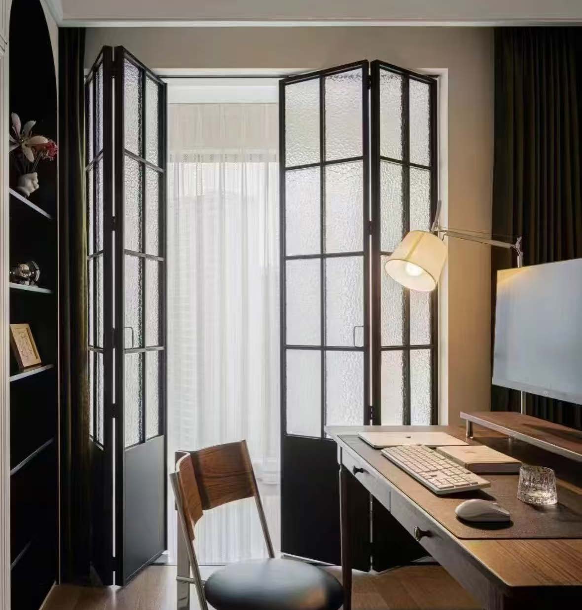 Folding glass door folded back against the wall