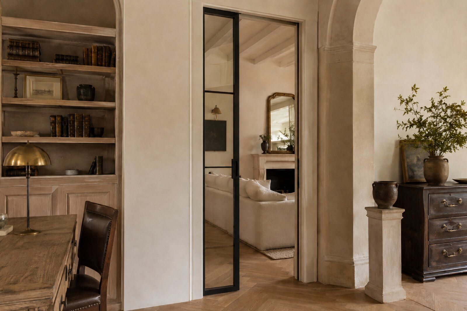 Interior pocket door receding into the wall, slim aluminum frame around fluted glass